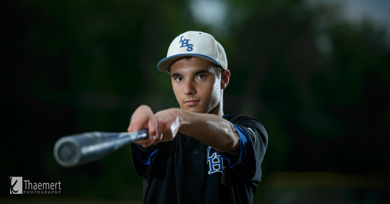 High School Senior Baseball Player with his Bat