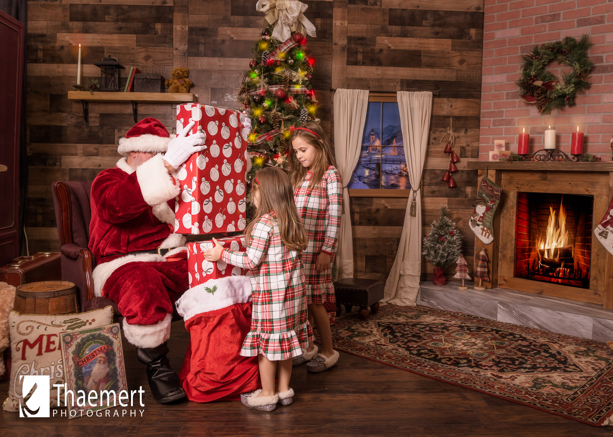 Santa giving really BIG gifts to two girls Photo Session