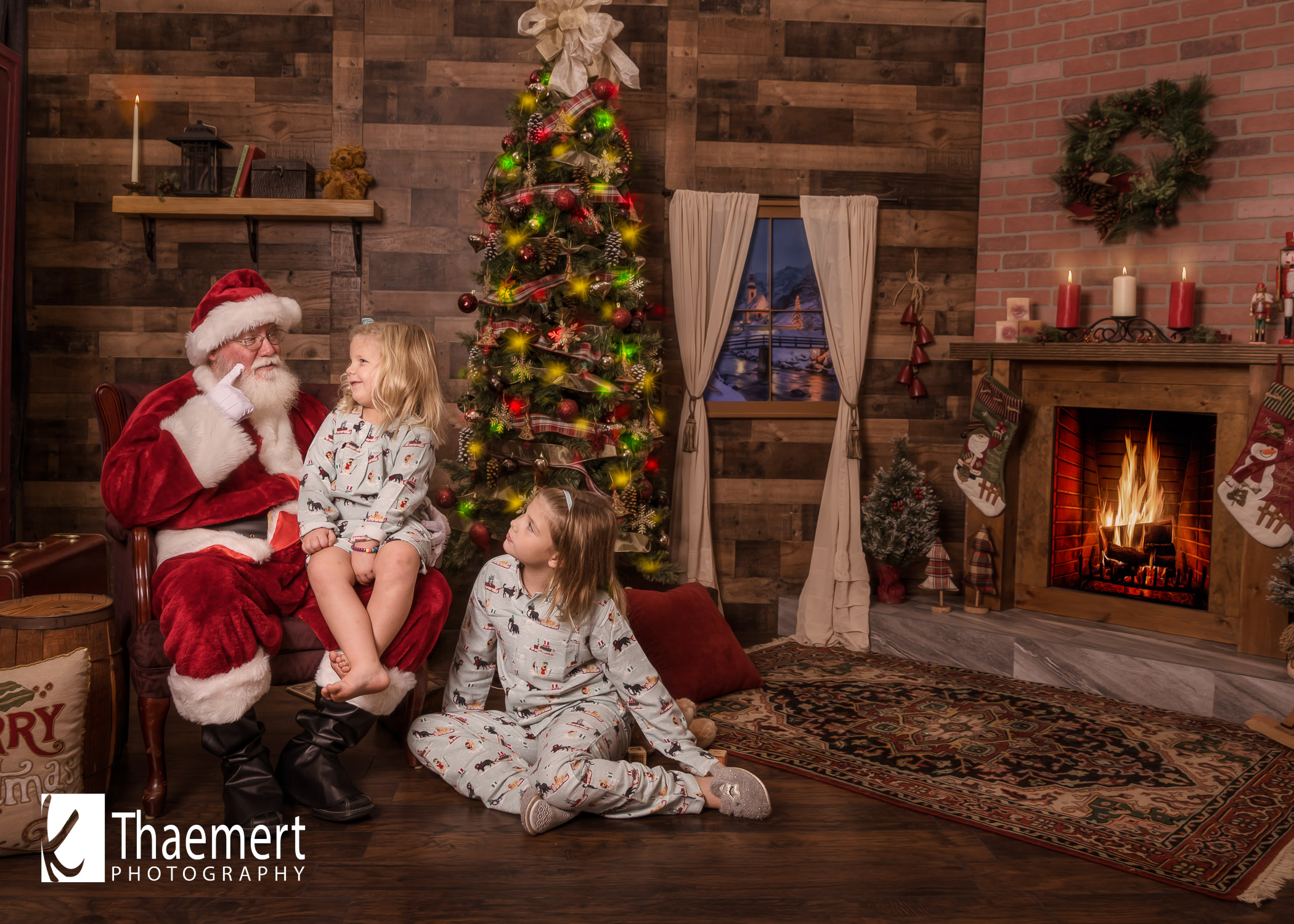 Santa Telling Two Sisters Stories at their Photo Session